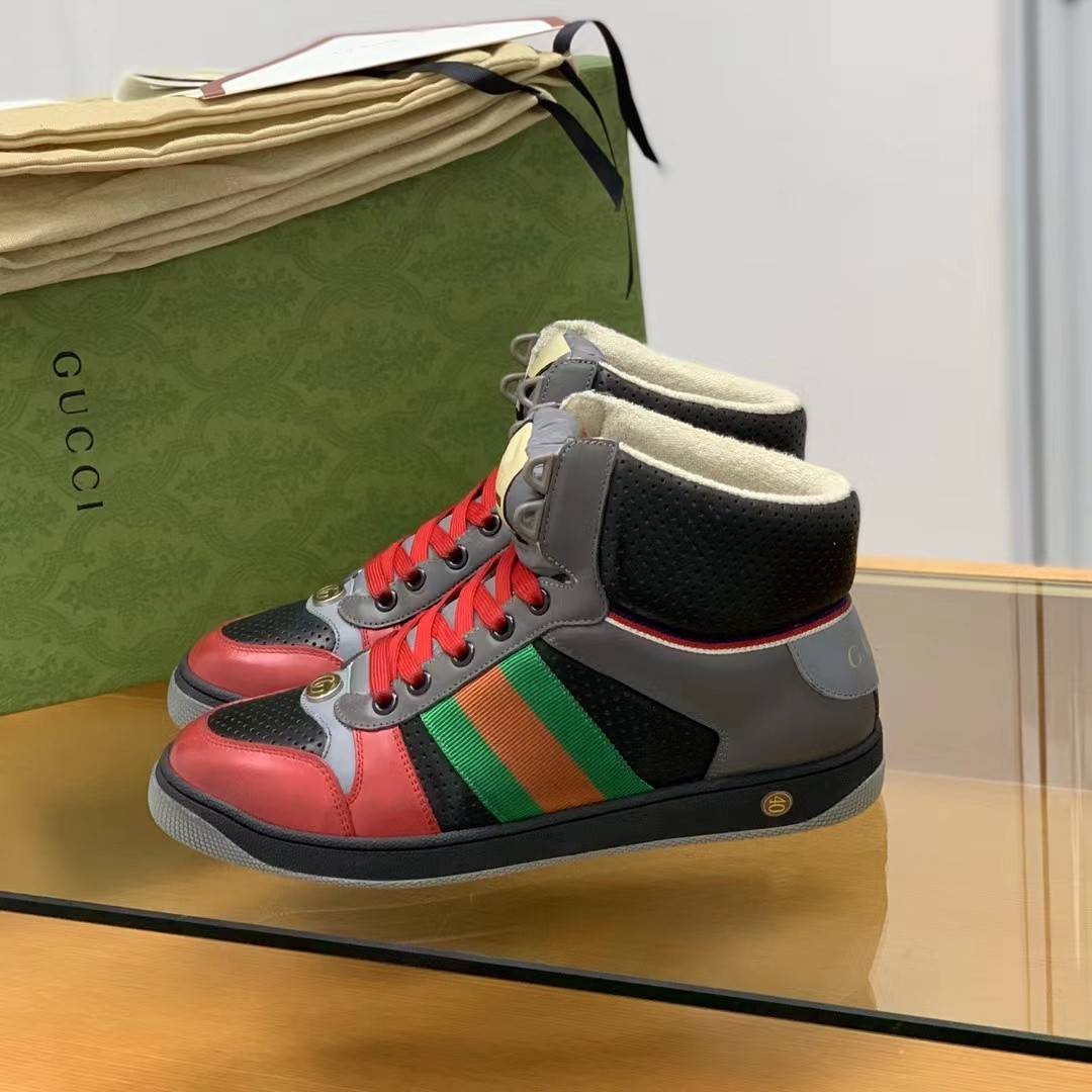 GU*IHigh-top Distressed sneakers