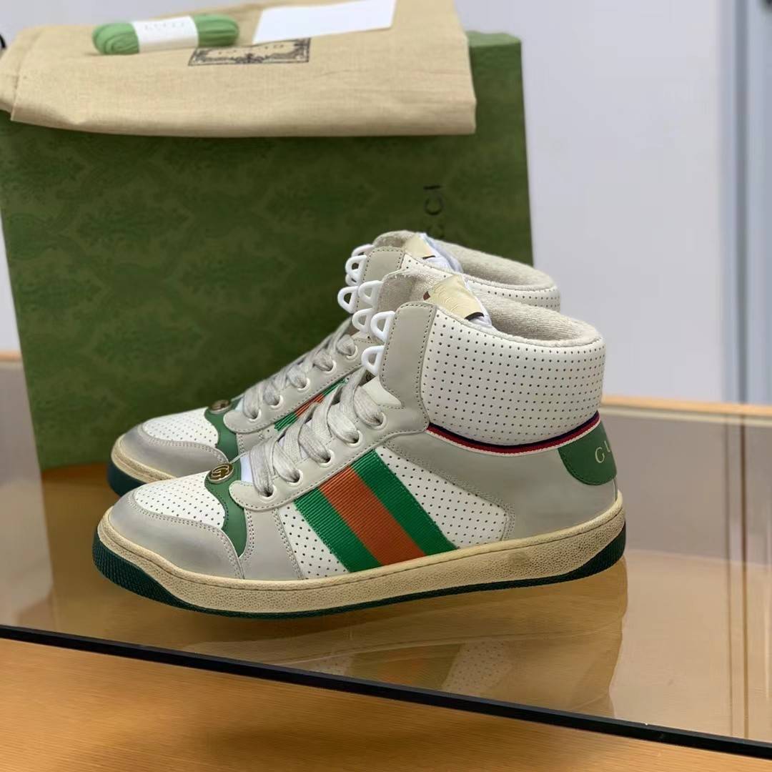 GU*IHigh-top Distressed sneakers