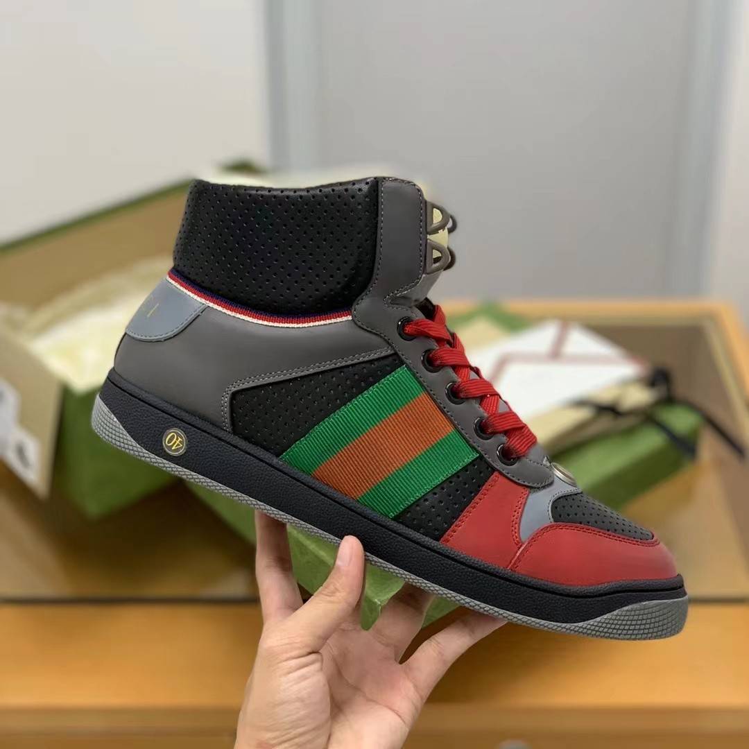 GU*IHigh-top Distressed sneakers